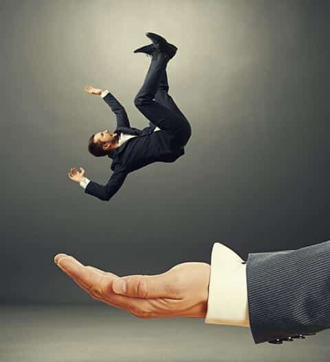 Businessman falling into the hand of a professional writer.