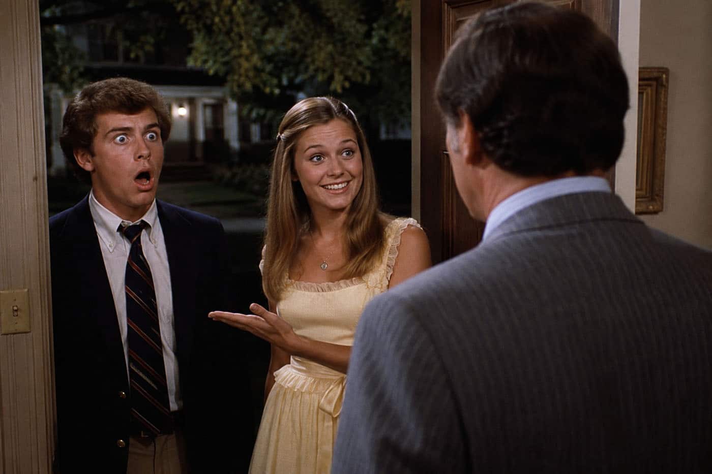 A daughter introduces her date to her father, who bears an uncanny resemblance to Dean Wormer from Animal House.