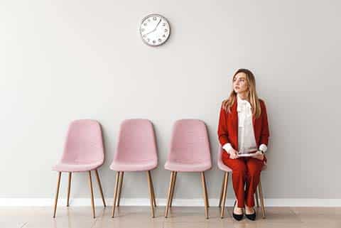 Woman waiting for her interview for a ghostwriting job.