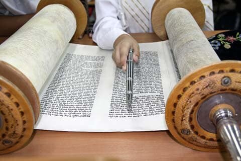 Reading the Torah scroll. Ghostwriters Central provides a variety of writing services for the Jewish community.